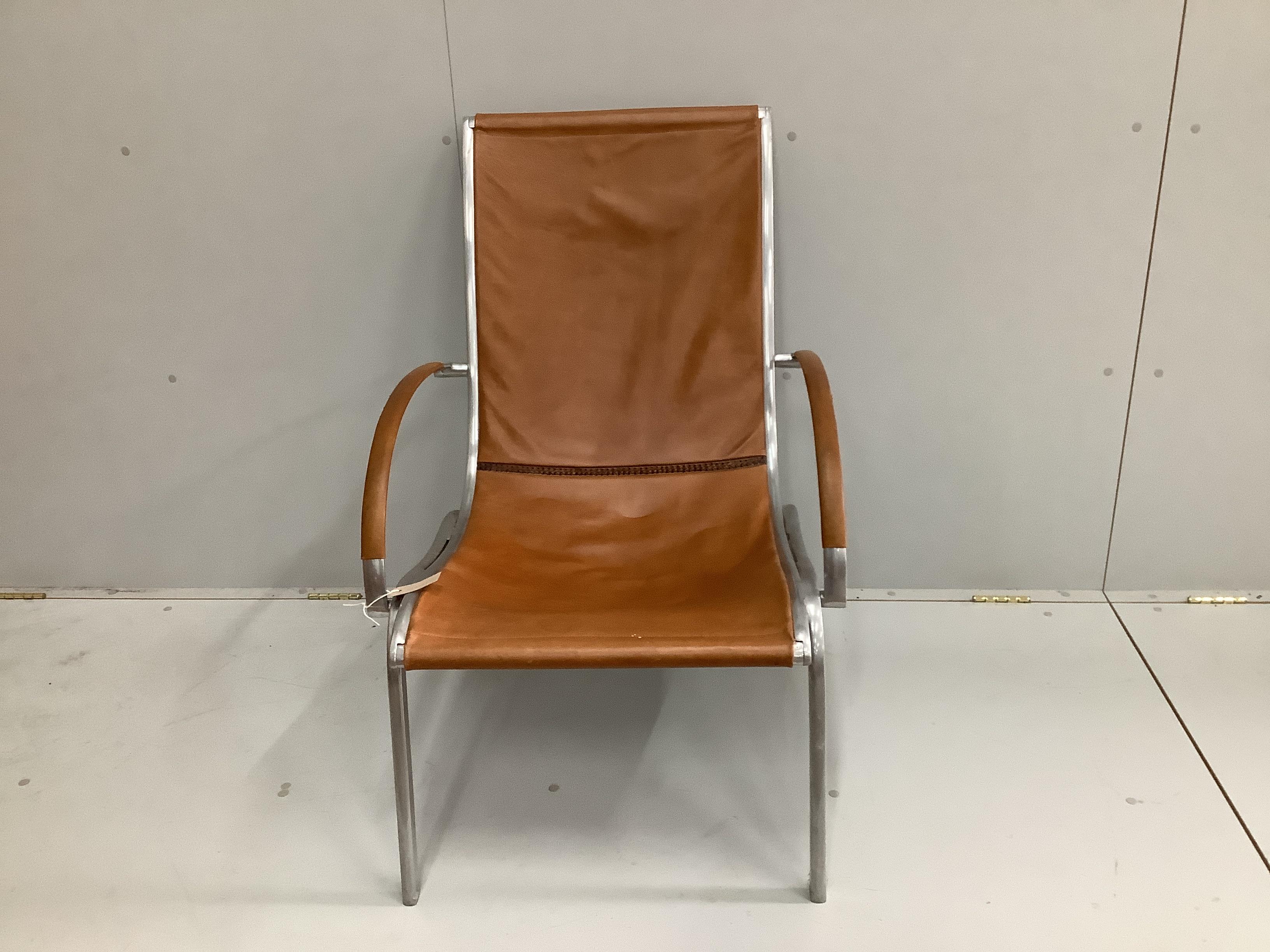 A 1970's armchair in the style of Rudolf Szedleczky, width 65cm, depth 84cm, height 94cm
